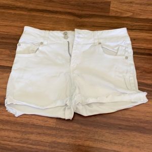 White denim high waisted shorts.